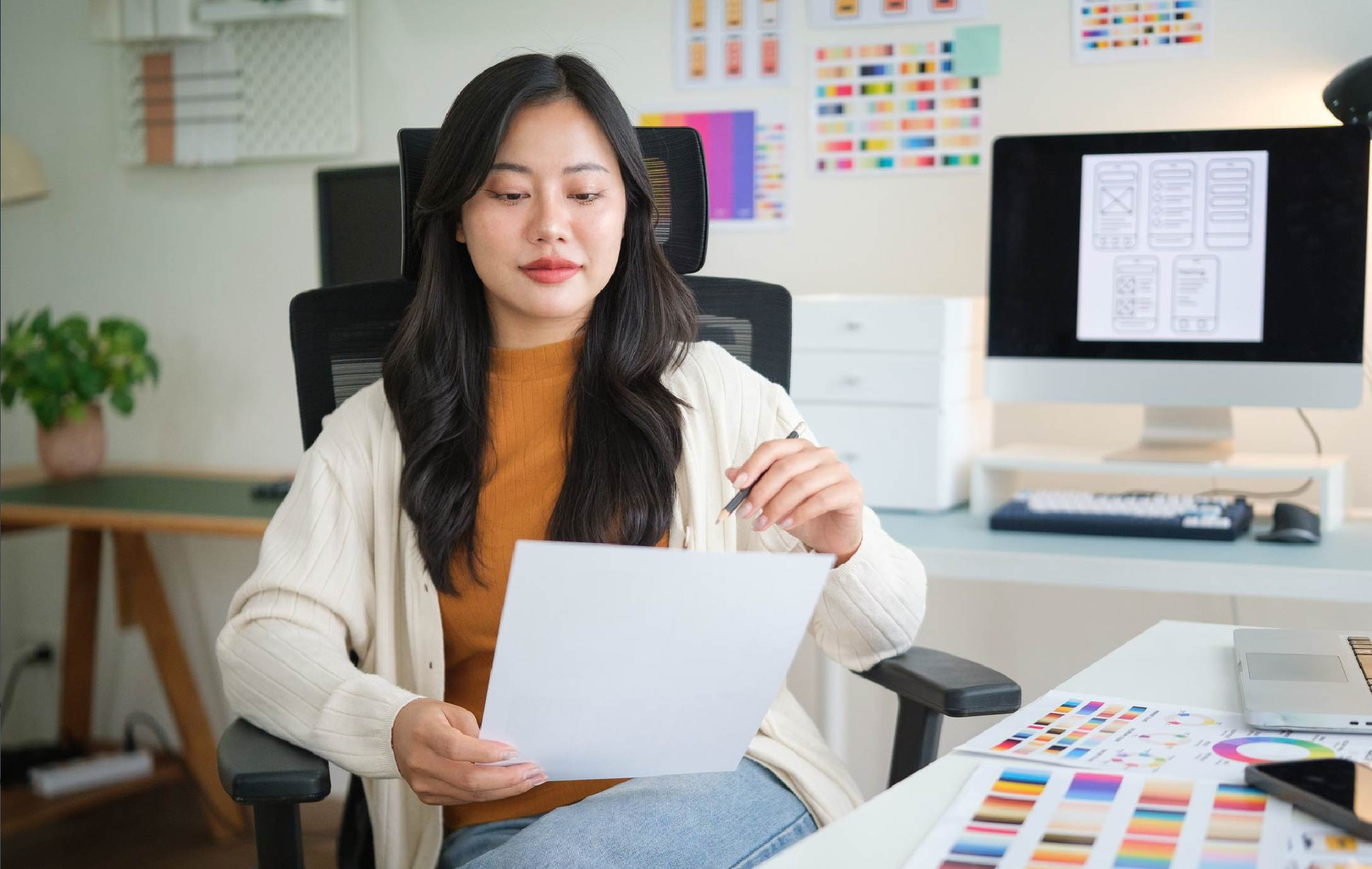 professional woman ux ui designer planning digital product layout and colour scheme